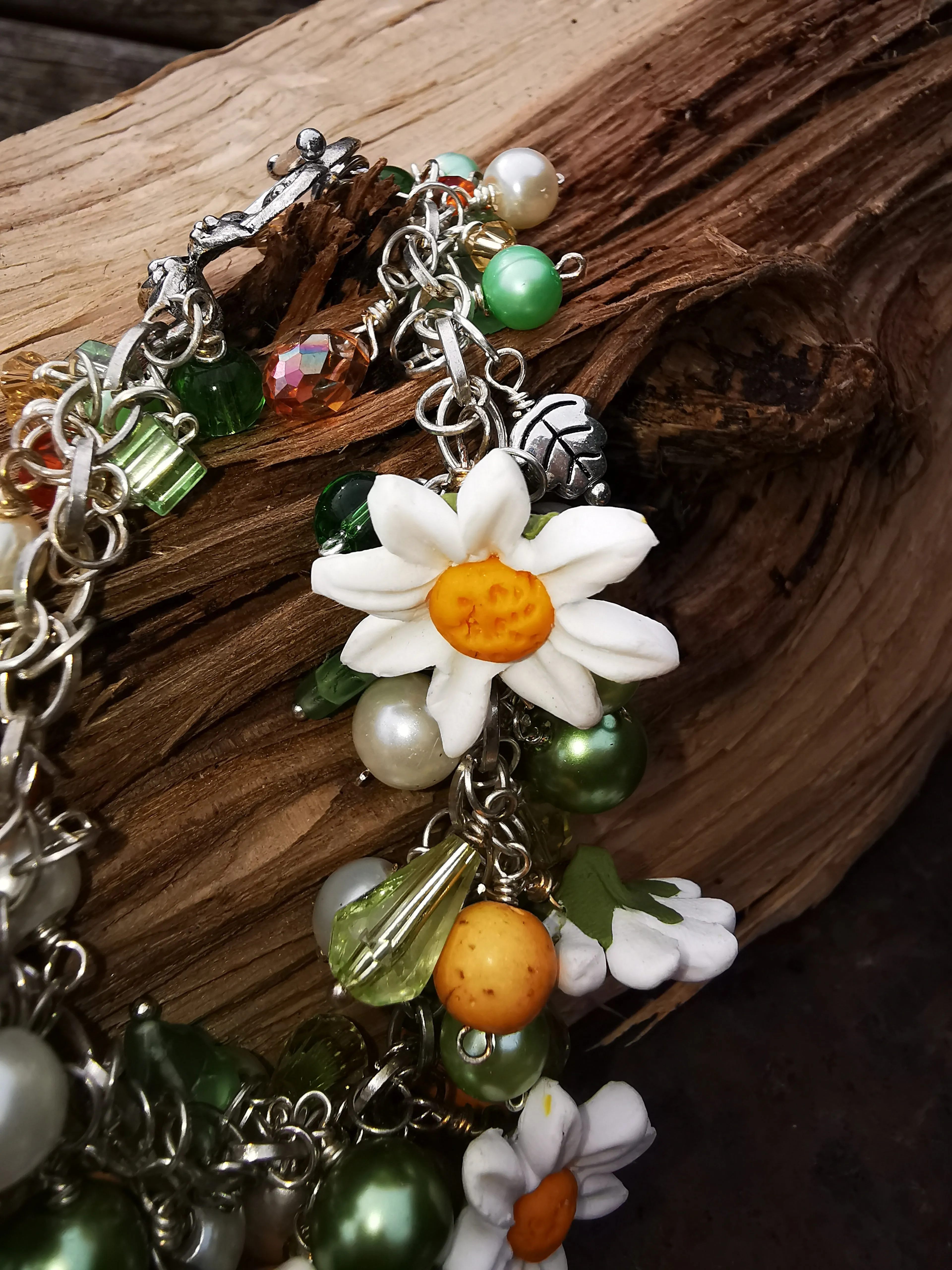 Daisy Chain, cluster charm bracelet with handmade polymer clay daises, 7.5 inches.